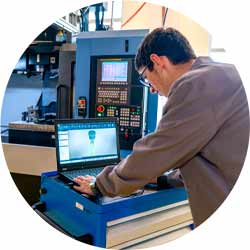 Student in Technical Vocational Training with A CNC Machine