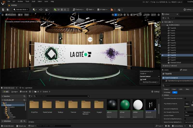 Interface d’un logiciel de modélisation 3D (Unreal Engine) montrant un plateau virtuel « LA CITÉ » avec un décor moderne et des éléments graphiques, mêlant scène circulaire, arrière-plan en bois, éclairages et interface du logiciel.